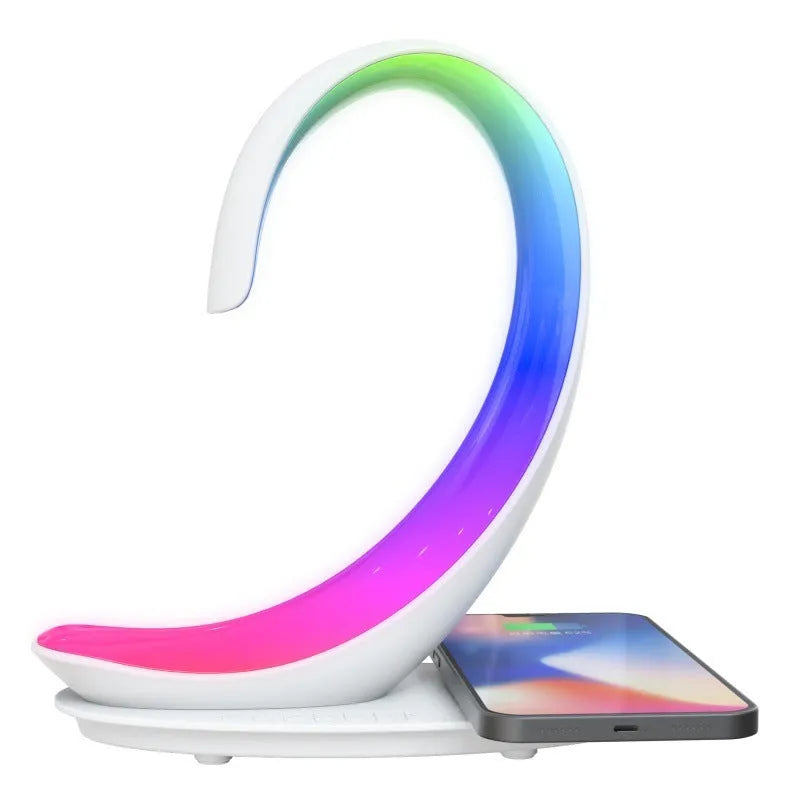 White swan-shaped desktop wireless charger with Bluetooth speaker and colourful atmosphere lighting
