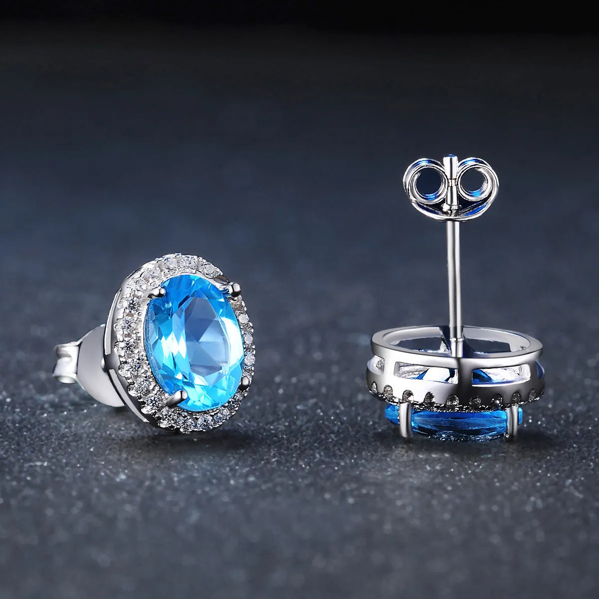 925 sterling silver blue topaz jewellery set with geometric design including earrings, necklace, ring and pendant