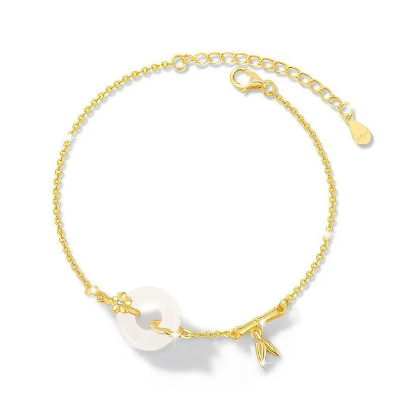 Women's silver bracelet with white chalcedony peace buckle charm and starry sky design