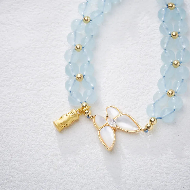 Women's aquamarine butterfly woven bracelet with retro styling and 6mm width
