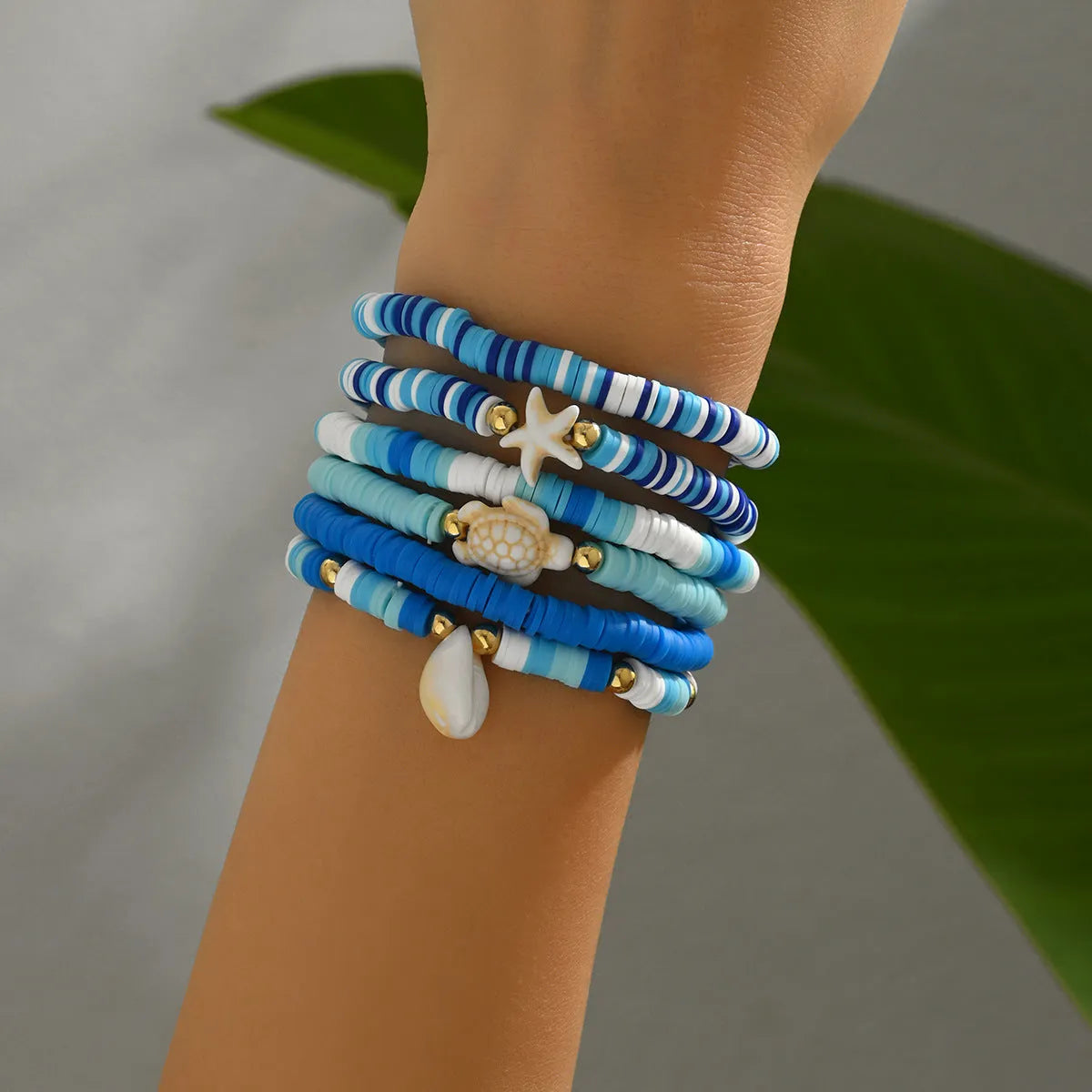 Six polymer clay handmade bracelets with Bohemian blue shells and geometric designs