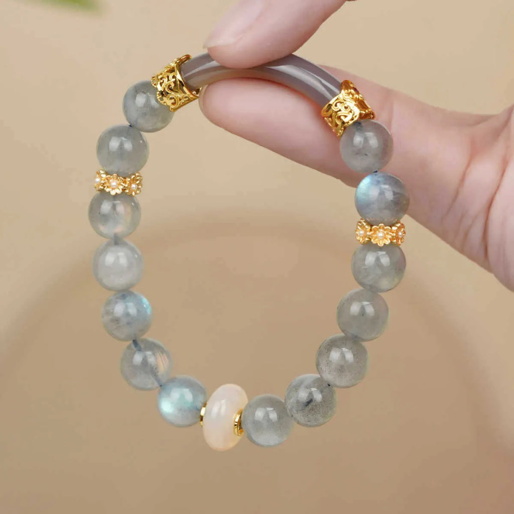 Gray moonstone agate women's half bracelet with 8mm round beads on a wrist.