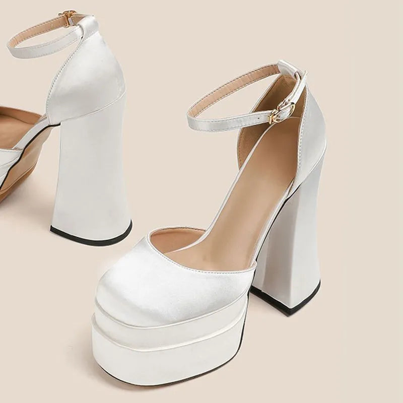 Women's white platform high heels with a chunky heel and round toe.