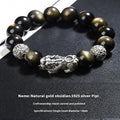 Men's geometric bracelet with a black obsidian bead and sterling silver clasp on a leather cord.