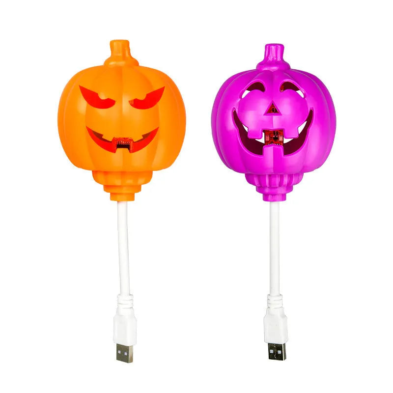 Plastic pumpkin-shaped decorative lamp with USB charging cable, showing purple or yellow light option.