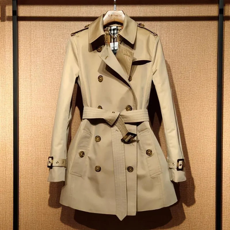 Women's khaki British double-breasted trench coat with flight sleeves on hanger