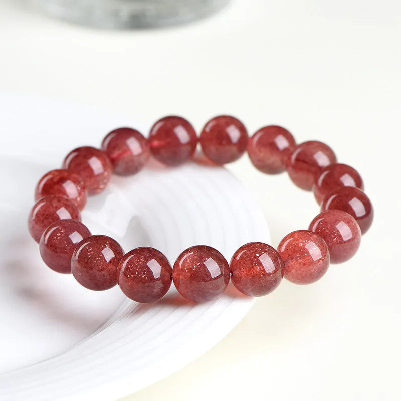 Natural strawberry quartz crystal bracelet with polished red geometry beads, shown in 3A and 5A grade options.