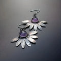 Purple bohemian earrings with zodiac animal design and resin gemstone detailing