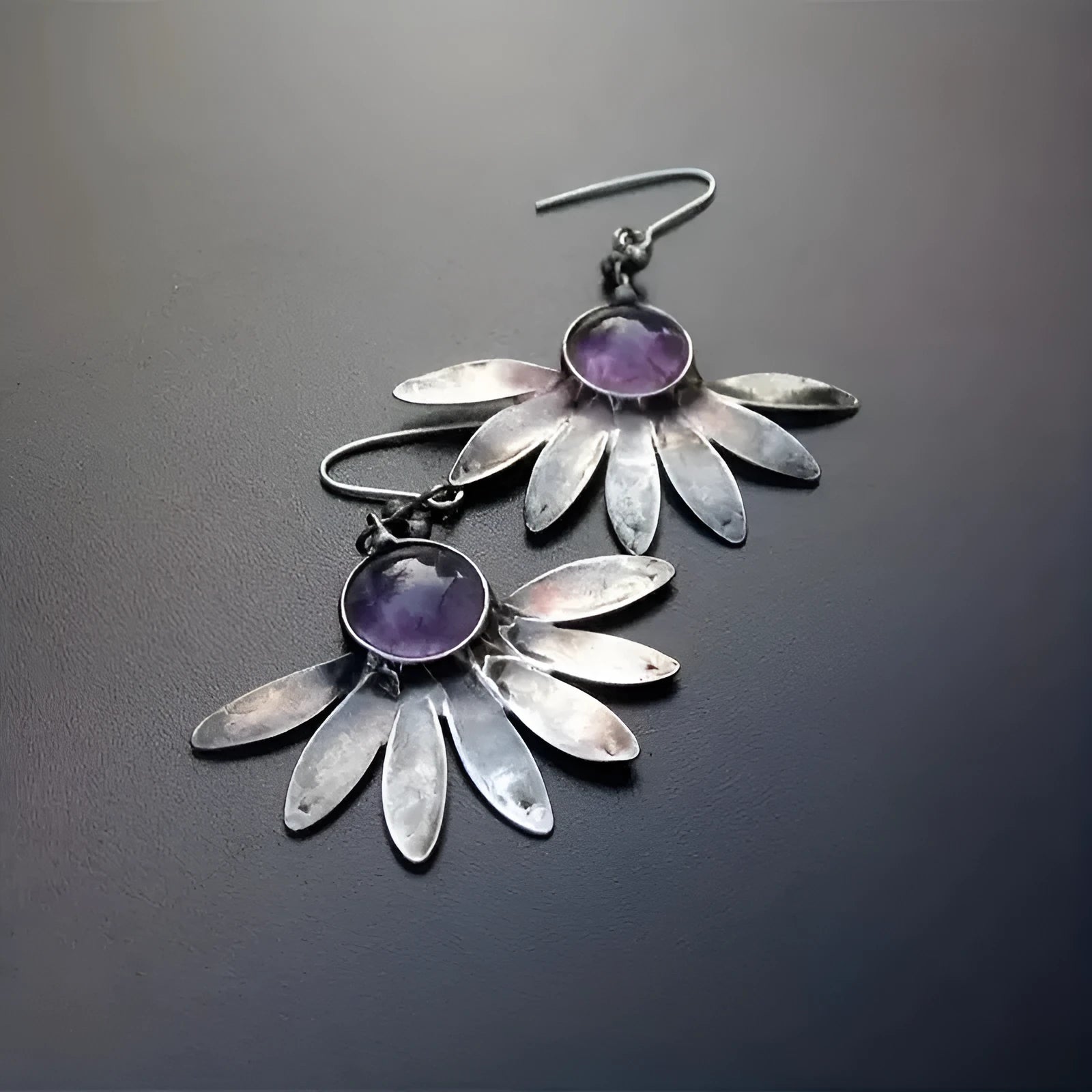 Purple bohemian earrings with zodiac animal design and resin gemstone detailing
