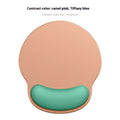 Silicone wristband mouse mat in a gradient colour on a desk