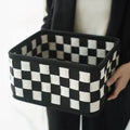 Checkerboard patterned folding felt storage basket showing collapsible sides.