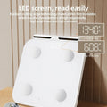 White professional body fat scale with eight electrodes and large tempered glass platform