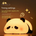 Cartoon panda night light with black and white silicone design on bedside table