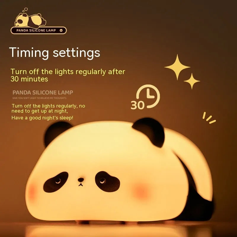 Cartoon panda night light with black and white silicone design on bedside table