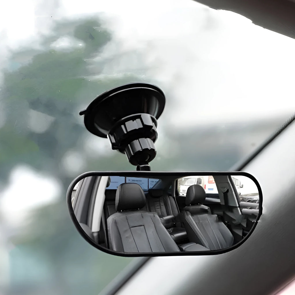Black 360-degree rotating car rearview mirror with a suction cup mount on a windscreen.