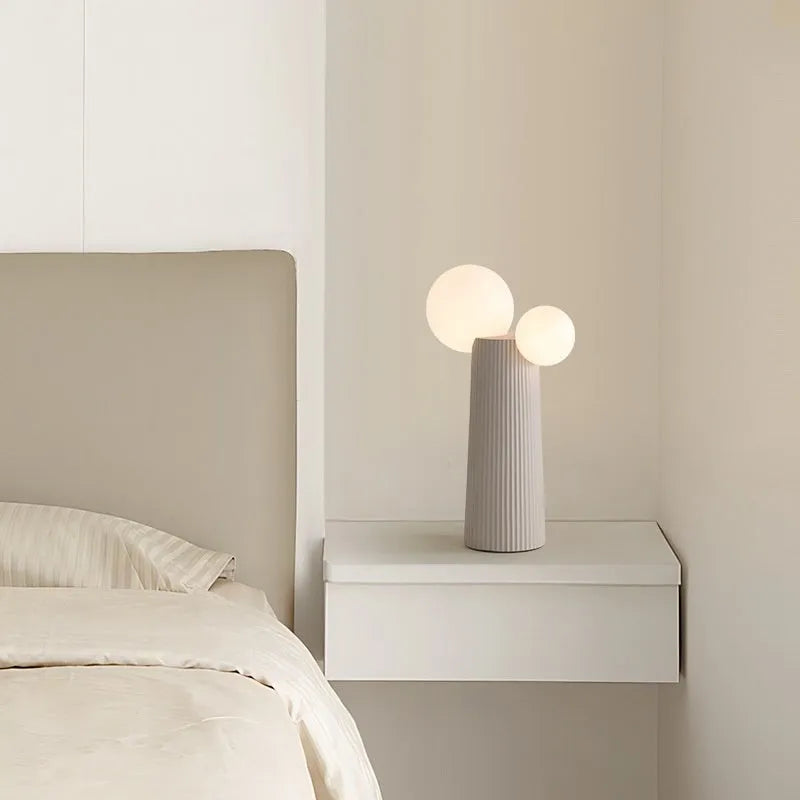 Modern minimalist cactus bedside lamp in milk coffee colour, resin and PE lampshade, 21cm diameter 40cm height, on bedside table