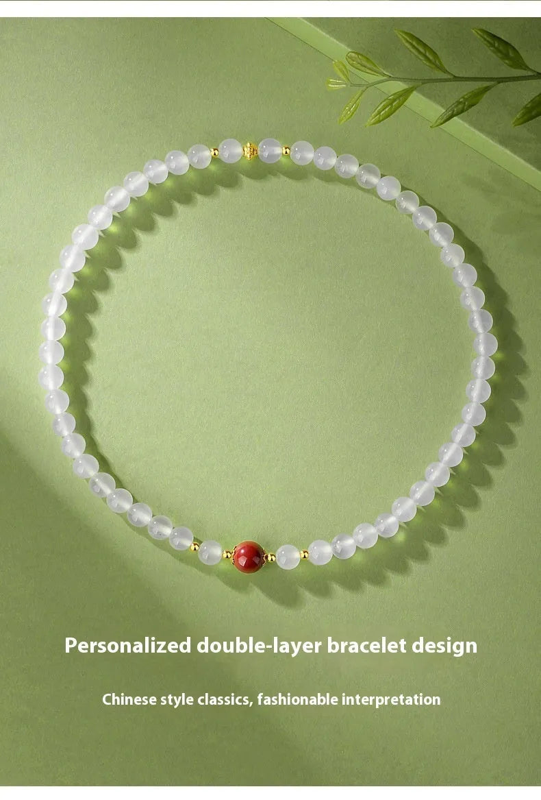 White agate double layer bracelet with jequirity bean cinnabar charm in geometric design