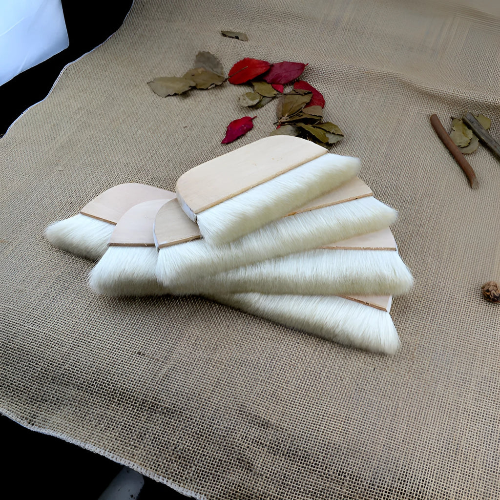 Wool brush for mounting diamond painting canvases, available in multiple sizes.