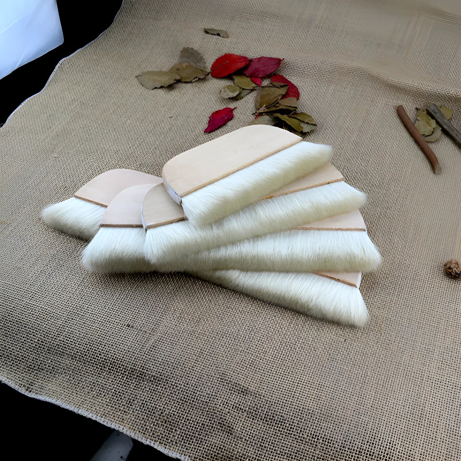 Wool brush for mounting diamond painting canvases, available in multiple sizes.