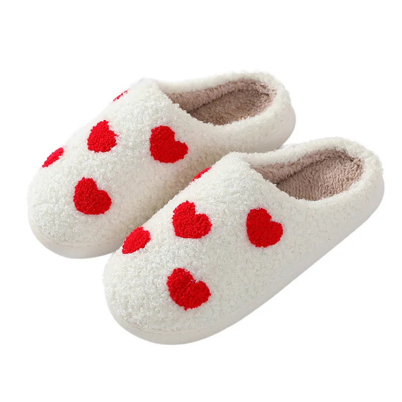 Women's plush cartoon love style home slippers in multiple colours with a non-slip PVC sole.