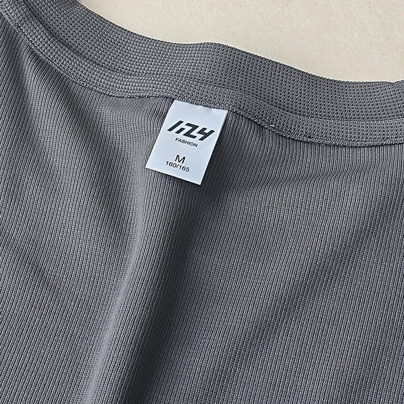 Men's dark grey waffle-knit short sleeve T-shirt showing textured fabric detail.