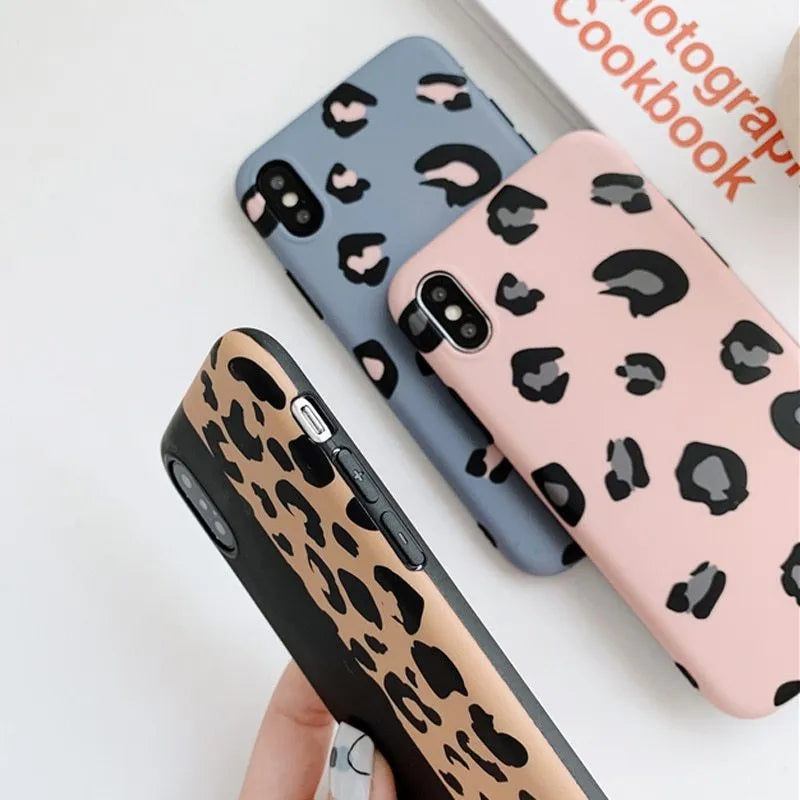 Leopard print iPhone case in black, blue, and pink colours for multiple iPhone models.