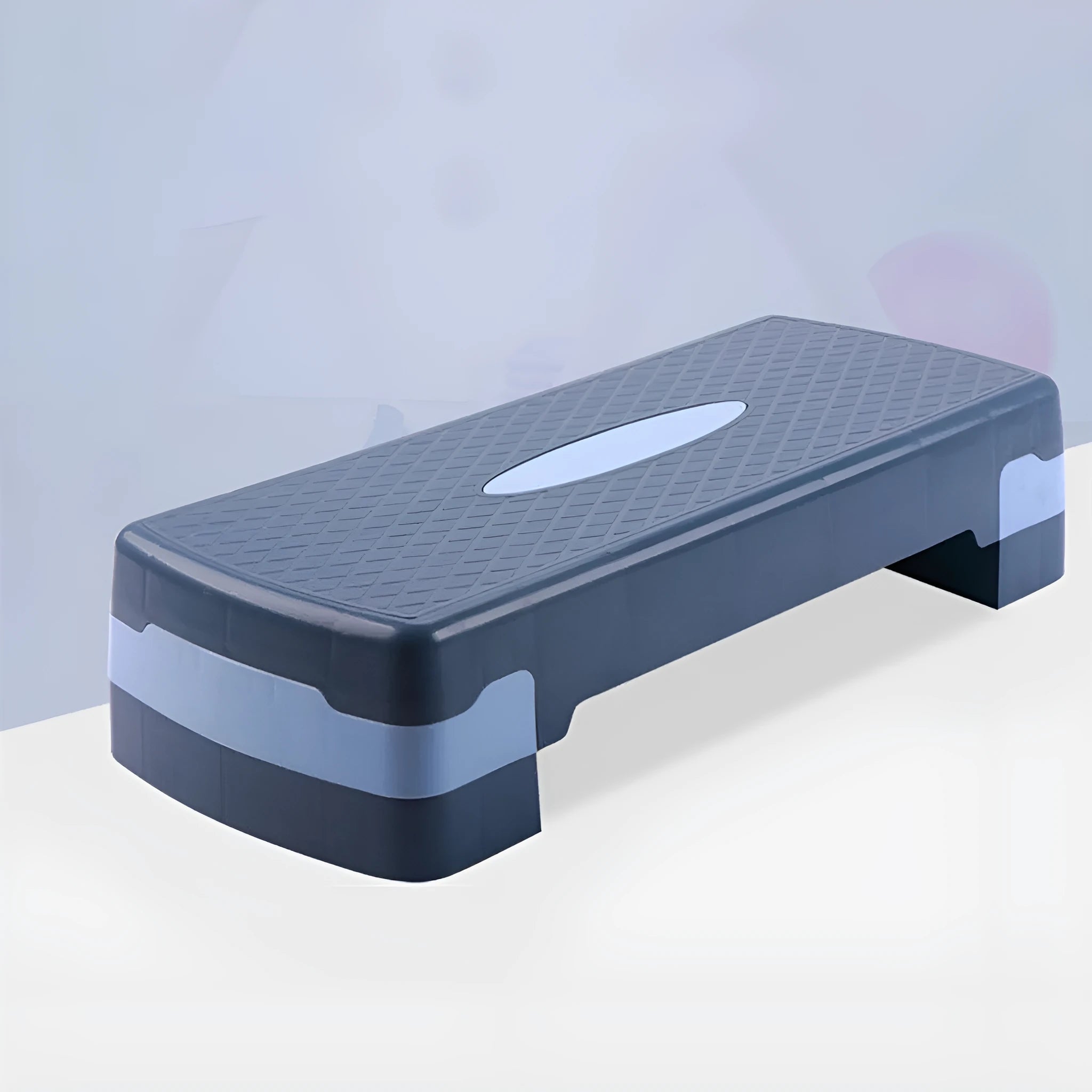 Grey Fit step aerobics platform on a wooden floor
