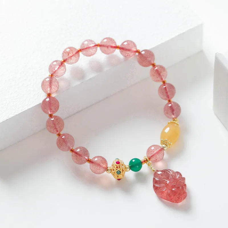 Women's crystal bracelet with strawberry quartz beads and nine tail fox charm