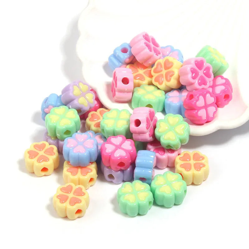 15mm frosted acrylic clover beads in mixed colours including pink, green, blue, and purple