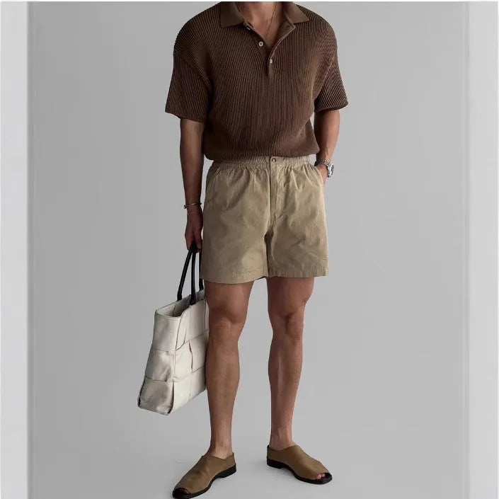 Cotton sports shorts in loose fit design shown in black, white and khaki colours