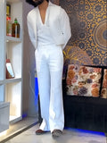White three-piece outfit showing V-neck shirt, sleeveless vest, and full-length trousers laid flat