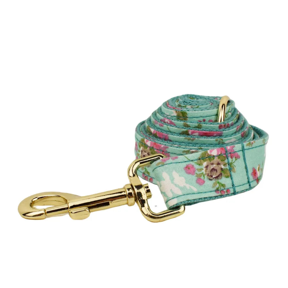 Rose patterned fabric dog collar set with green background and detachable bow accessory