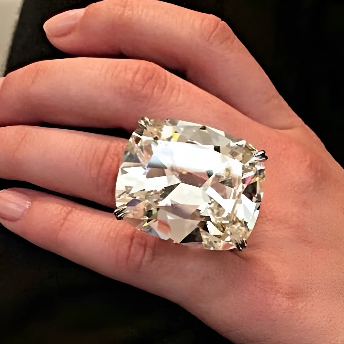 Simple white gold-coloured alloy ring with an inlaid square diamond geometric design.
