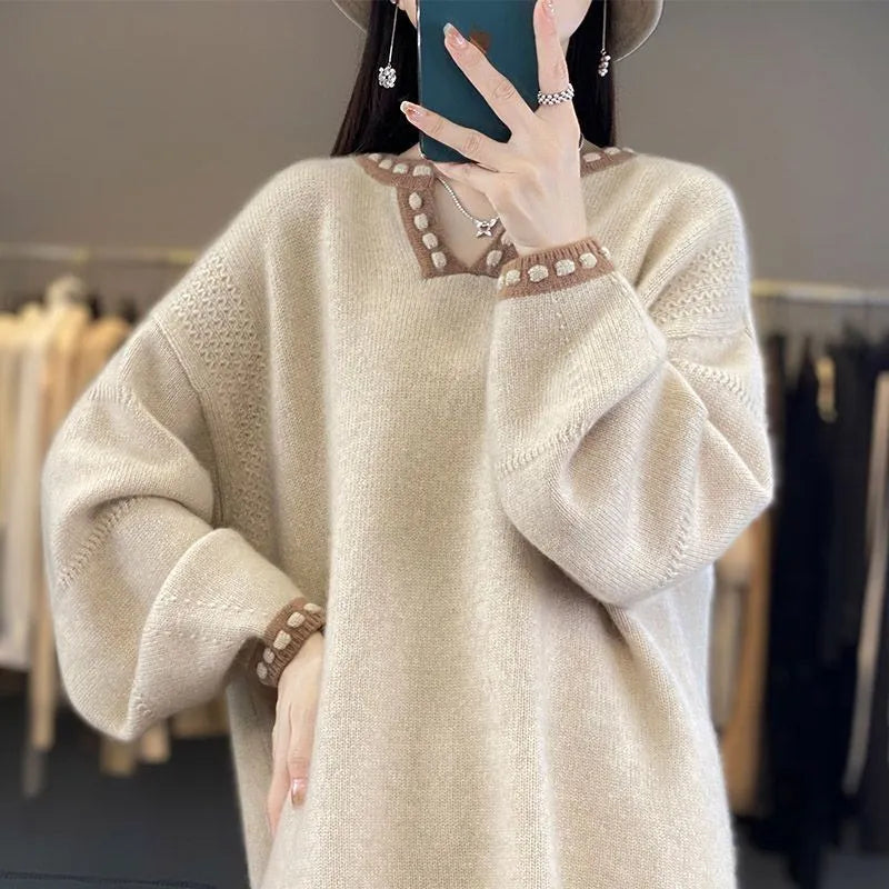 Women's camel-coloured V-neck long sleeve viscose sweater laid flat.