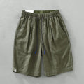 Men's linen shorts in straight drooping style with drawstring waist, shown in green and black colour options