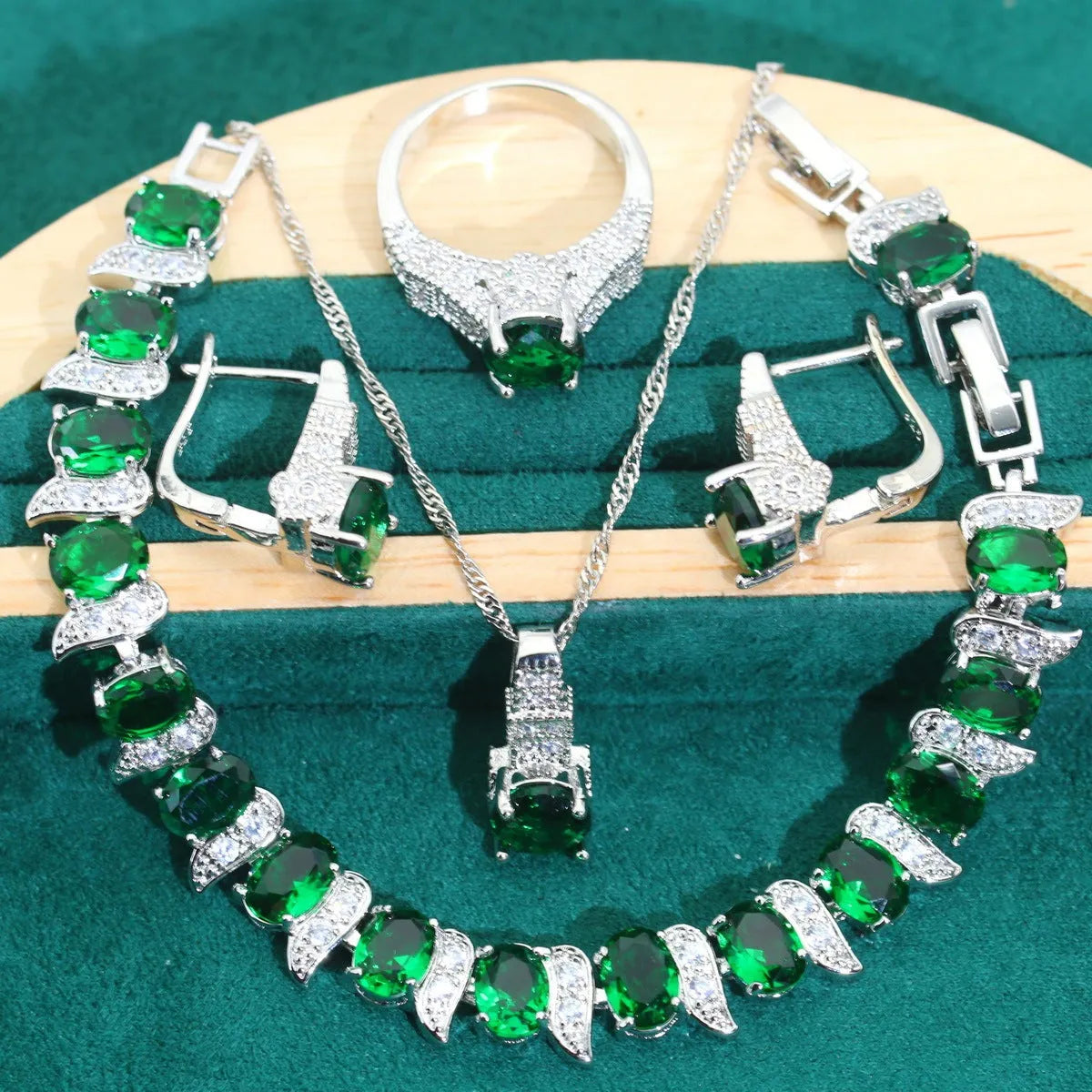 Bridal zircon jewellery set showing necklace, earrings, bracelet, and ring pieces with water wave chain design