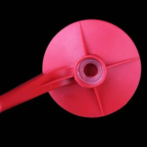 Red Magic Tap soda dispenser attached to inverted 2-litre bottle for push-button drink serving