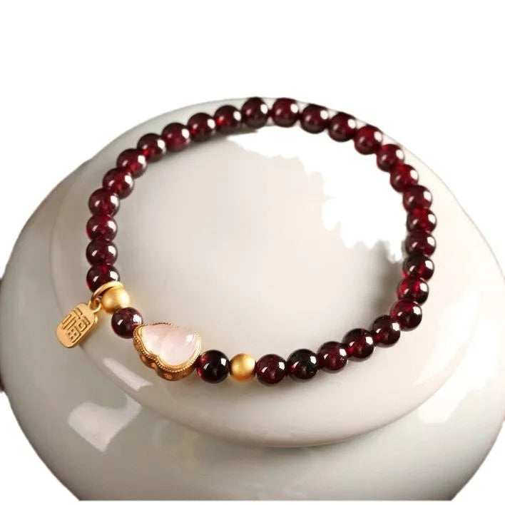 Chinese-style women's gourd bracelet with imitation garnet beads and Fu character.