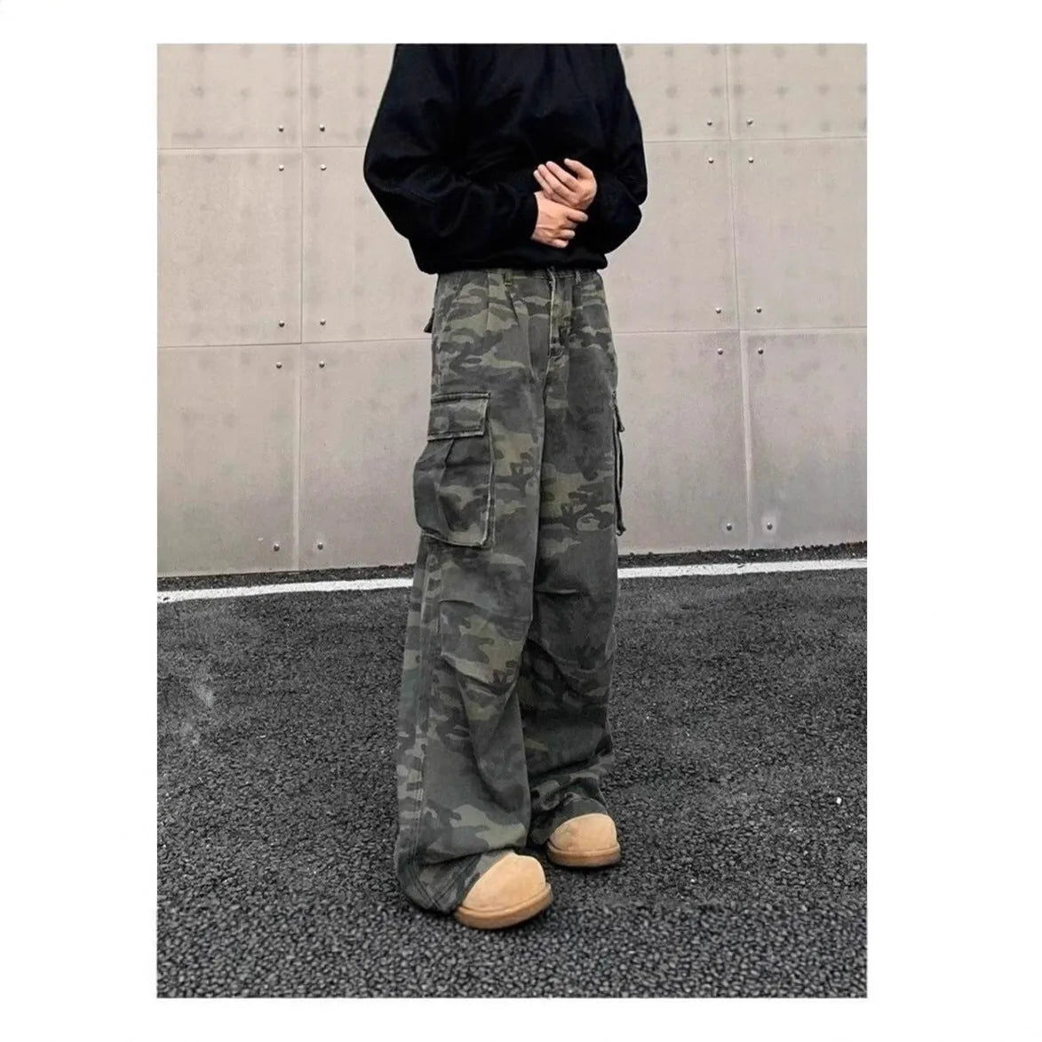 Men's washed camouflage cargo trousers with multiple pockets showing cotton blend fabric
