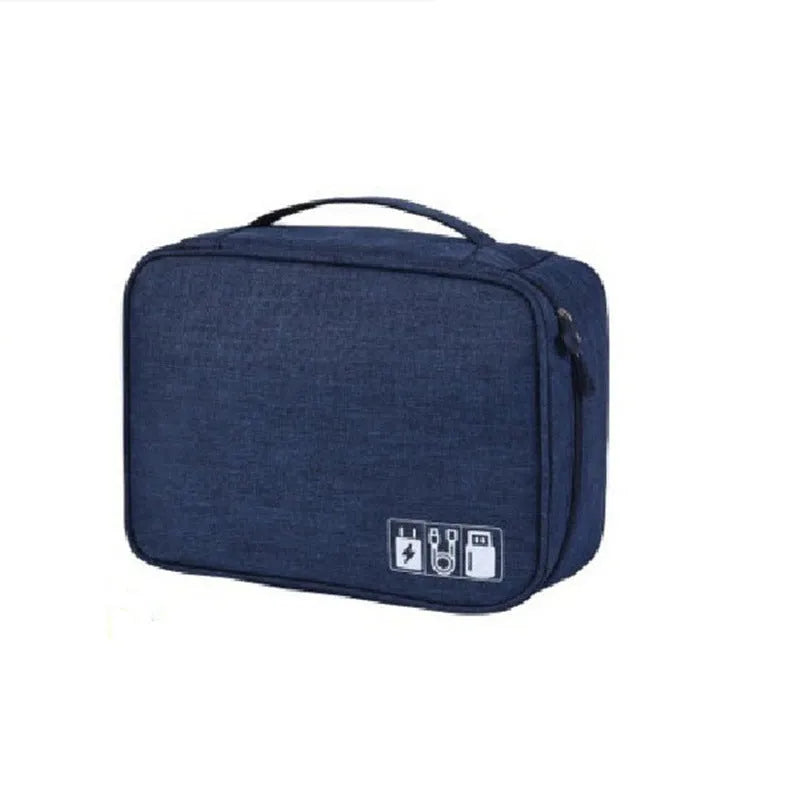 Blue cationic fabric electronics organiser bag with compartments for cables and headsets.