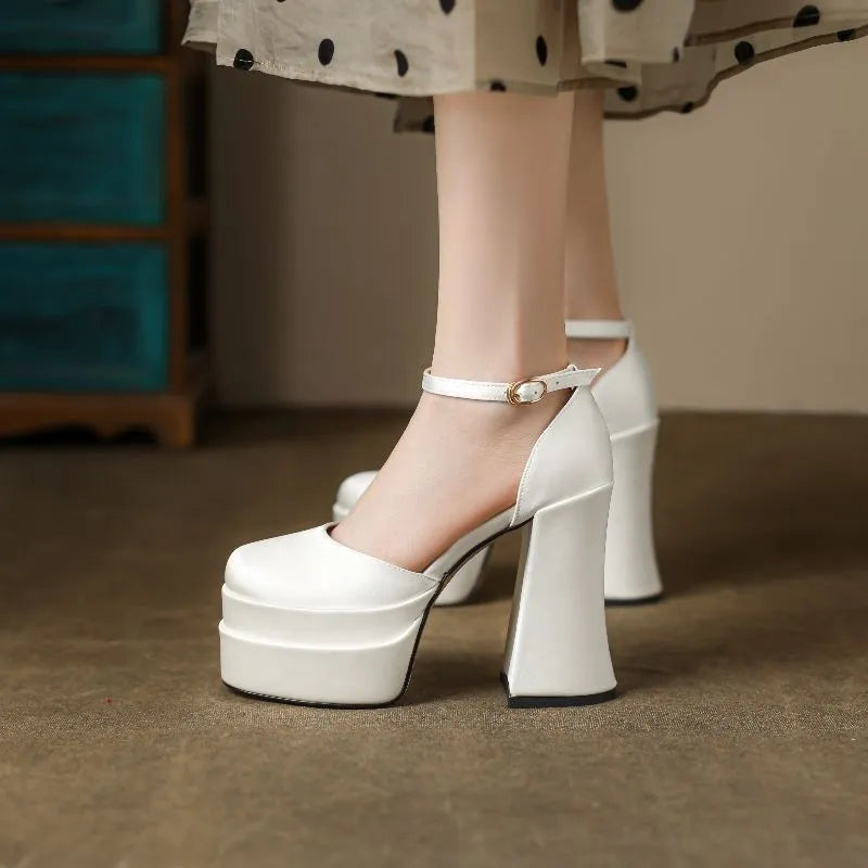 Women's white platform high heels with a chunky heel and round toe.