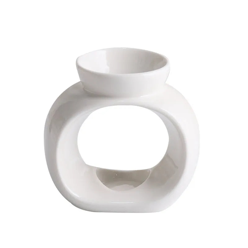 White Nordic style ceramic aromatherapy stove ornament on display