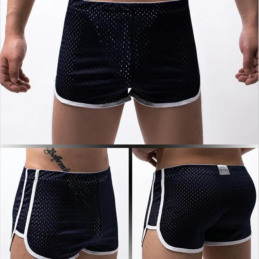 Men's black three-point boxer shorts on a white background showing mid-waist design.