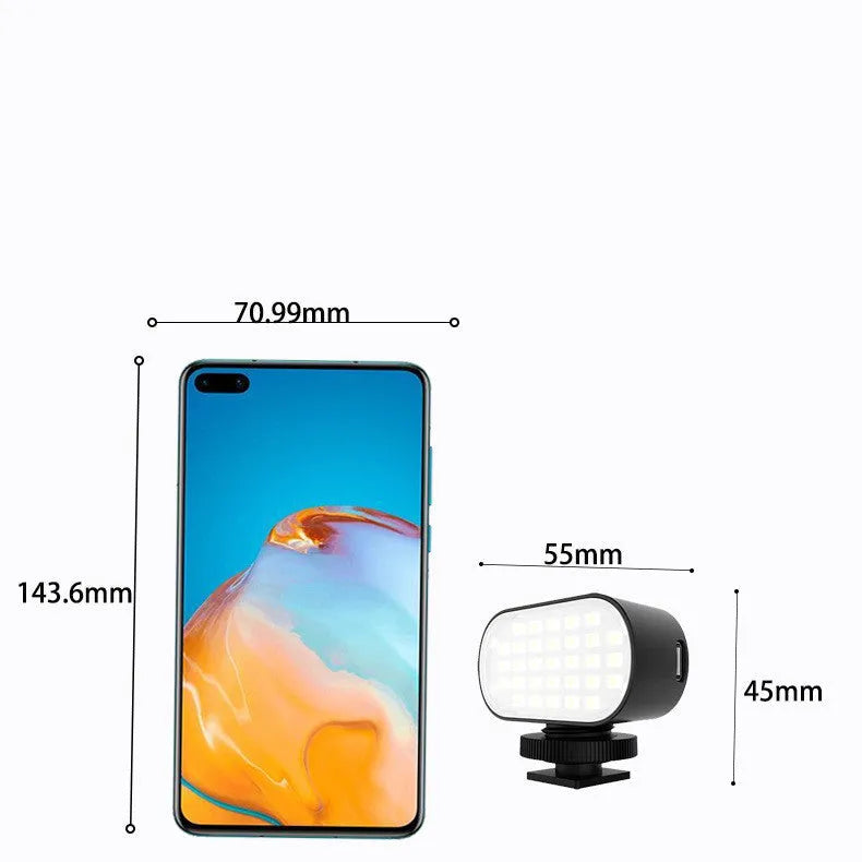 ST-30 black mobile phone fill light with digital display and cold shoe mount on a stand