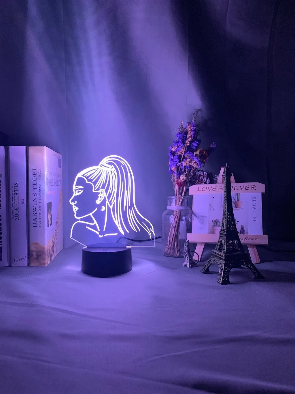 Slim black-based acrylic 3D LED wall night light showing multi-colour illumination