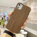 Slim wooden back cover case for iPhone showing natural rosewood grain texture.