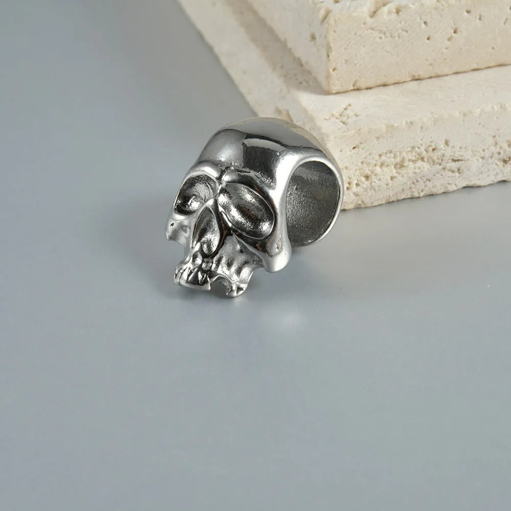 Stainless steel geometric earrings with hollow skull and Buddha head design in gold, black, steel, or Buddha head finish.
