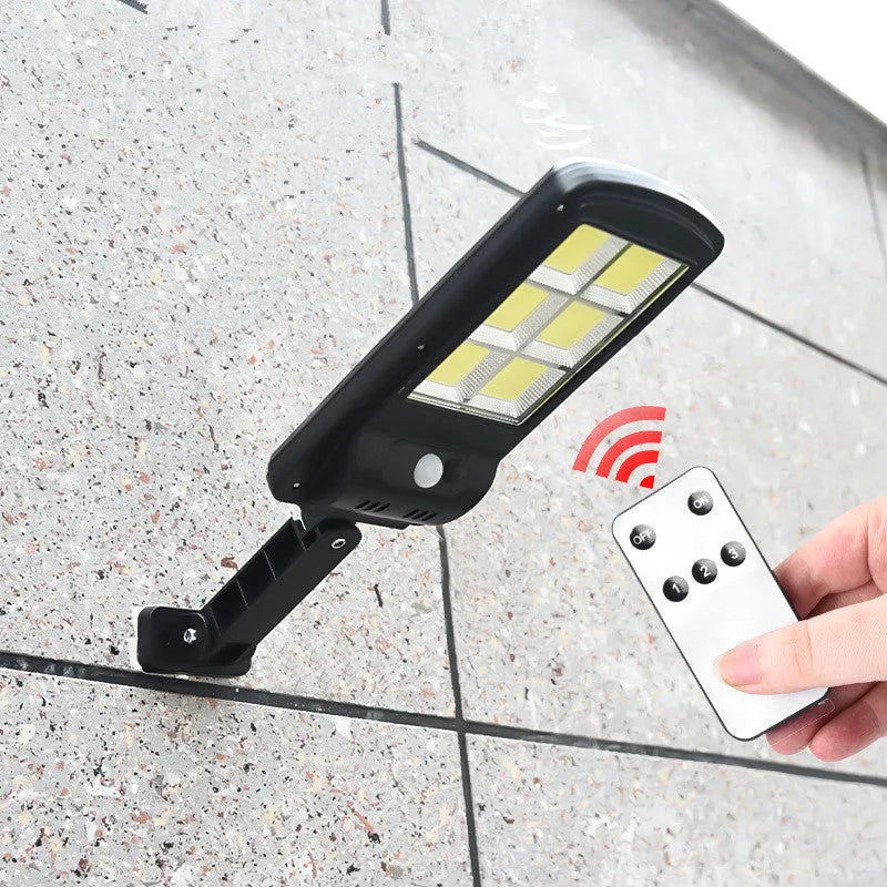 Black solar motion sensor light for outdoor security with IP65 waterproof rating