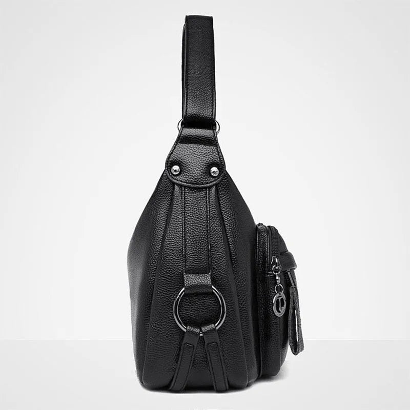 Large blue PU crossbody shoulder bag with multiple internal compartments and luggage-style design