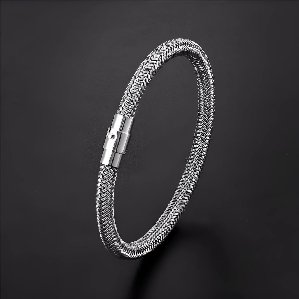 Titanium steel wire bracelet with magnetic clasp in a geometric line design on a wrist.